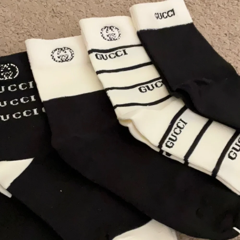 Gucci Men's Black and White Striped Socks Collection